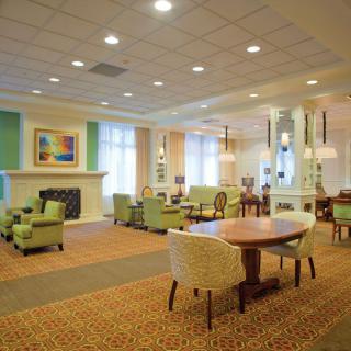 A spacious and well-lit lobby with comfortable seating and modern decor.