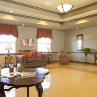 A cozy lobby with comfortable seating and warm lighting.