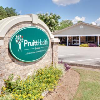 Pruitt Health facility showcasing its welcoming entrance and landscaped surroundings.