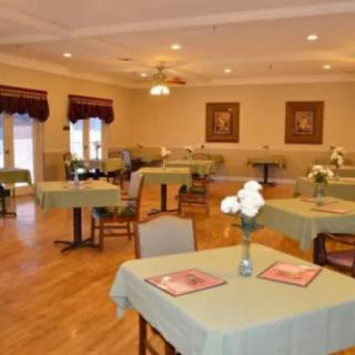 An elegant dining area with neatly arranged tables and chairs.