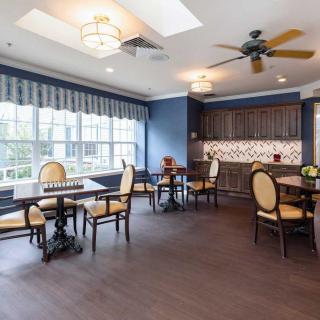 A cozy dining area with elegant furniture and natural lighting.