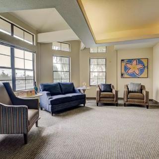 A modern living room with elegant furnishings and artwork.