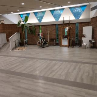 A spacious and modern indoor lobby featuring decorative elements and greenery.