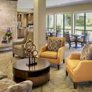A modern living room with comfortable seating and natural lighting.