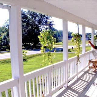 A serene porch view inviting relaxation and appreciation of the surrounding nature.