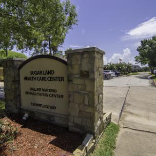 A sign for the Maryland Welcome Center, indicating a welcoming facility along a road.