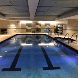 A serene indoor swimming pool, perfect for relaxation and fitness.