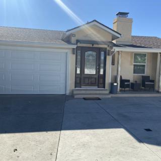 A single-story residential home with a garage and driveway.