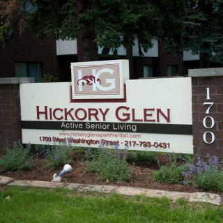 Sign for Hickory Glen Active Senior Living with contact details.