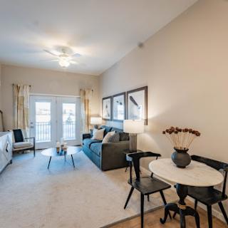 A beautifully designed modern living room featuring a comfortable seating area and stylish decor.