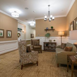 A cozy seating area with comfortable chairs and warm lighting.