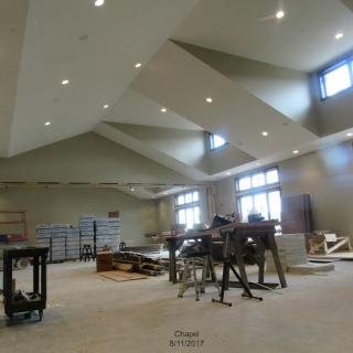 An unfinished interior space under construction with tools and building materials.