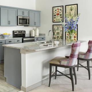 Modern kitchen with an island and stylish decor.