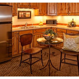 Cozy kitchen with wooden cabinets and a small dining area.