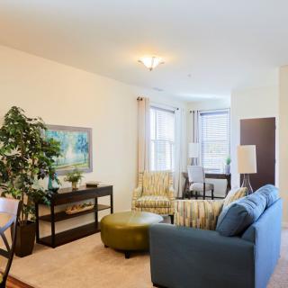 A modern living room with comfortable seating and stylish decor.