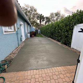 Freshly poured concrete patio ready for finishing touches.