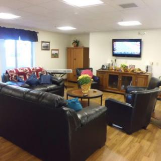 A cozy living room setup with comfortable seating and a TV.