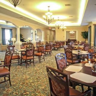 An elegant dining area with ornate furniture and soft lighting.