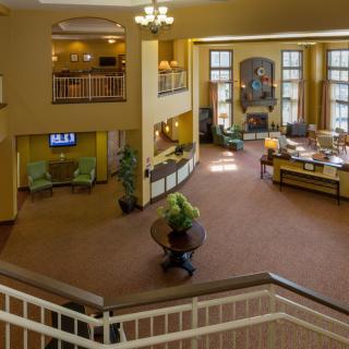 Elegant hotel lobby with a spacious reception area and grand staircase.