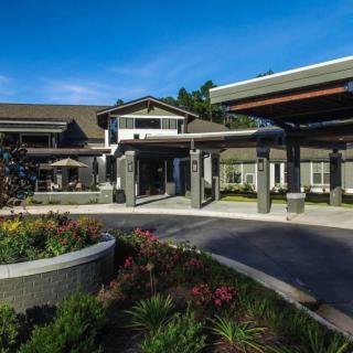 Modern building entrance with landscaped garden.