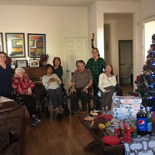 A heartwarming family gathering celebrating the holidays together, surrounded by gifts and festive decorations.