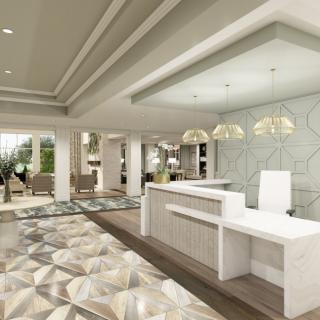 A modern hotel lobby with a sleek reception desk and elegant lighting.