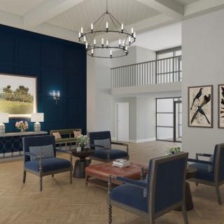 A modern living room with blue accent walls, stylish furniture, a grand chandelier, and artistic decor.