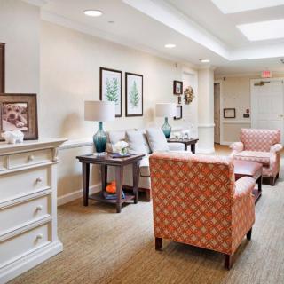 A cozy living room with comfortable seating and decorative elements.