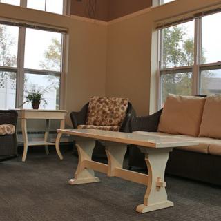 A cozy living room with comfortable seating and a rustic coffee table.