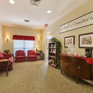 A cozy waiting room with comfortable seating and warm lighting.