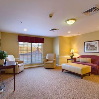 A cozy living room with comfortable seating and warm lighting.