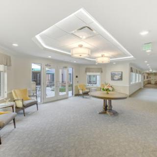 A bright and inviting lobby area featuring comfortable seating and modern lighting fixtures.
