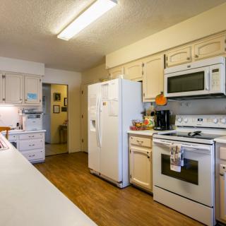 A cozy kitchen with modern appliances and ample countertop space.