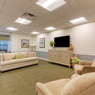 A cozy living room with comfortable seating, a flat-screen TV, and tasteful decor.