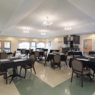 A well-lit dining or conference room set up for an event.