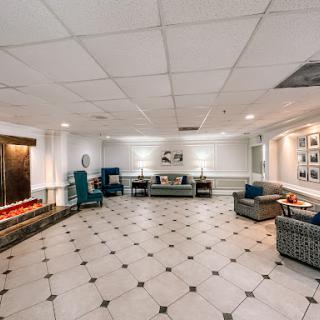 A spacious and inviting lobby area featuring comfortable seating and elegant decor.