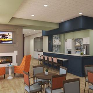 A modern lounge area featuring comfortable seating and a cozy fireplace.