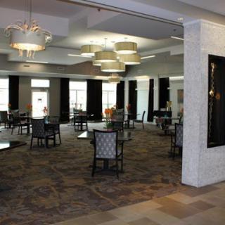 A spacious and elegantly designed lounge area with modern furniture and stylish lighting.