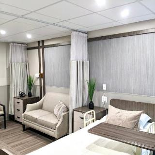 A stylish modern bedroom featuring comfortable furniture and a soothing color palette.