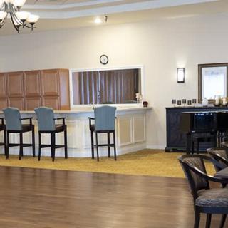 An inviting bar area with high chairs and a stylish counter.