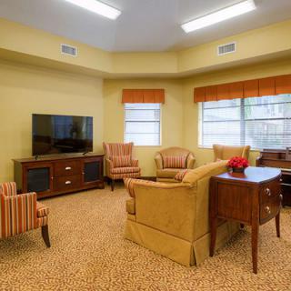 A cozy living room with comfortable seating and a warm, inviting atmosphere.