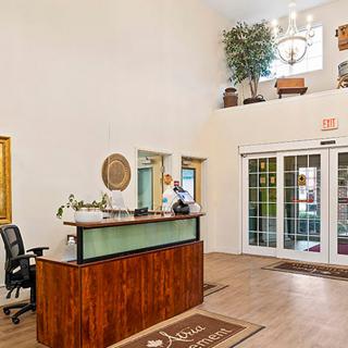 Lobby area with a reception desk and entrance.