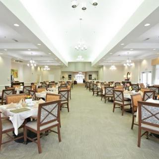 An elegant dining room with neatly arranged tables and chairs ready for guests.