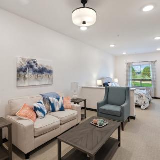 A modern living room with cozy furniture and elegant decor.