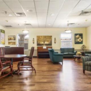 A spacious and well-lit living area with comfortable seating and decor.