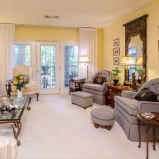 A cozy living room with traditional furnishings and decor.