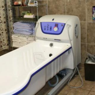 A specialized bathtub used in healthcare settings for assisted bathing and therapy.