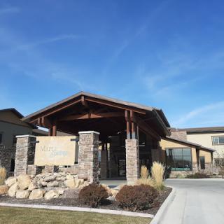 A welcoming entrance showcasing a blend of wood and stone architecture.