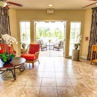 A bright and welcoming lobby area with comfortable seating and natural light streaming through large windows.
