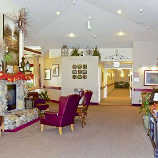 A cozy living room with a fireplace and comfortable seating.